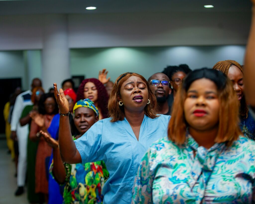 Congregation worshipping with hands raised