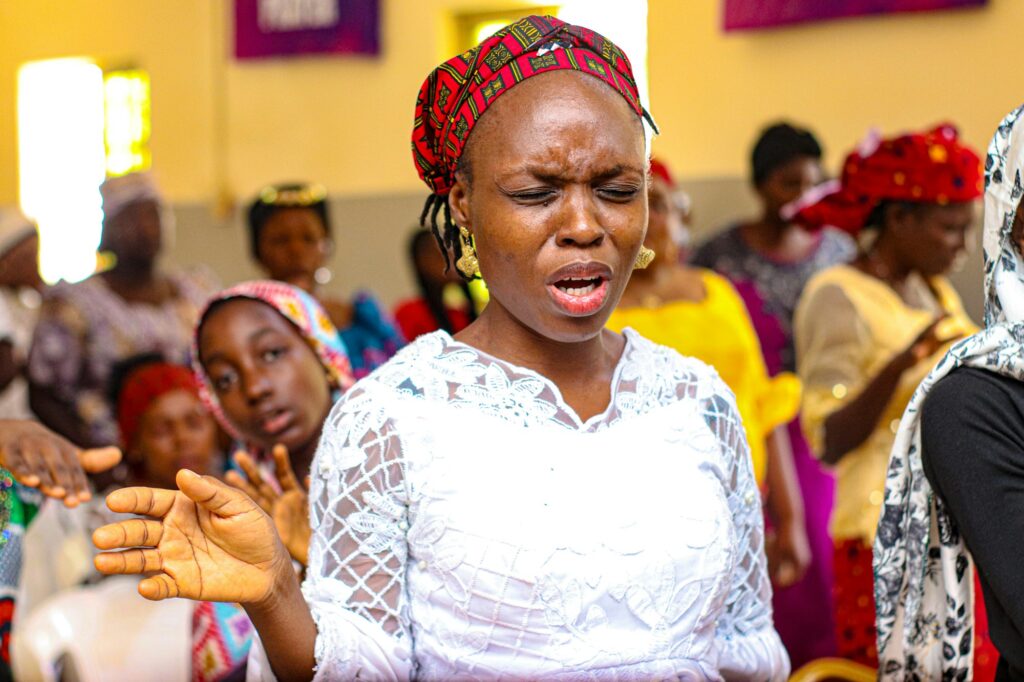 Woman praising God in church
